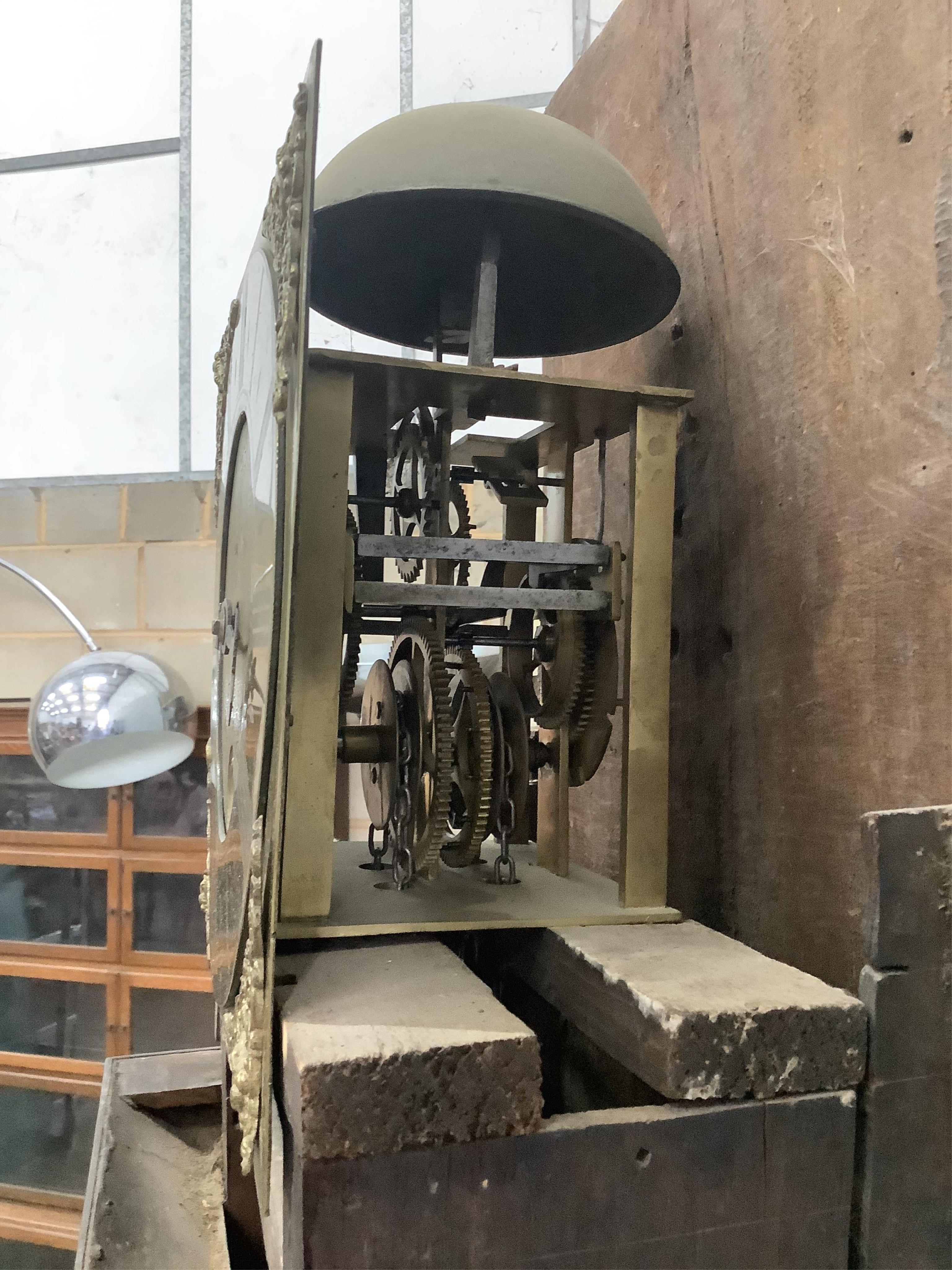 An early 18th century oak and mahogany thirty hour longcase clock, the square brass dial with a single hand, by William Budgen, Reigate, height 200cm. Condition - fair